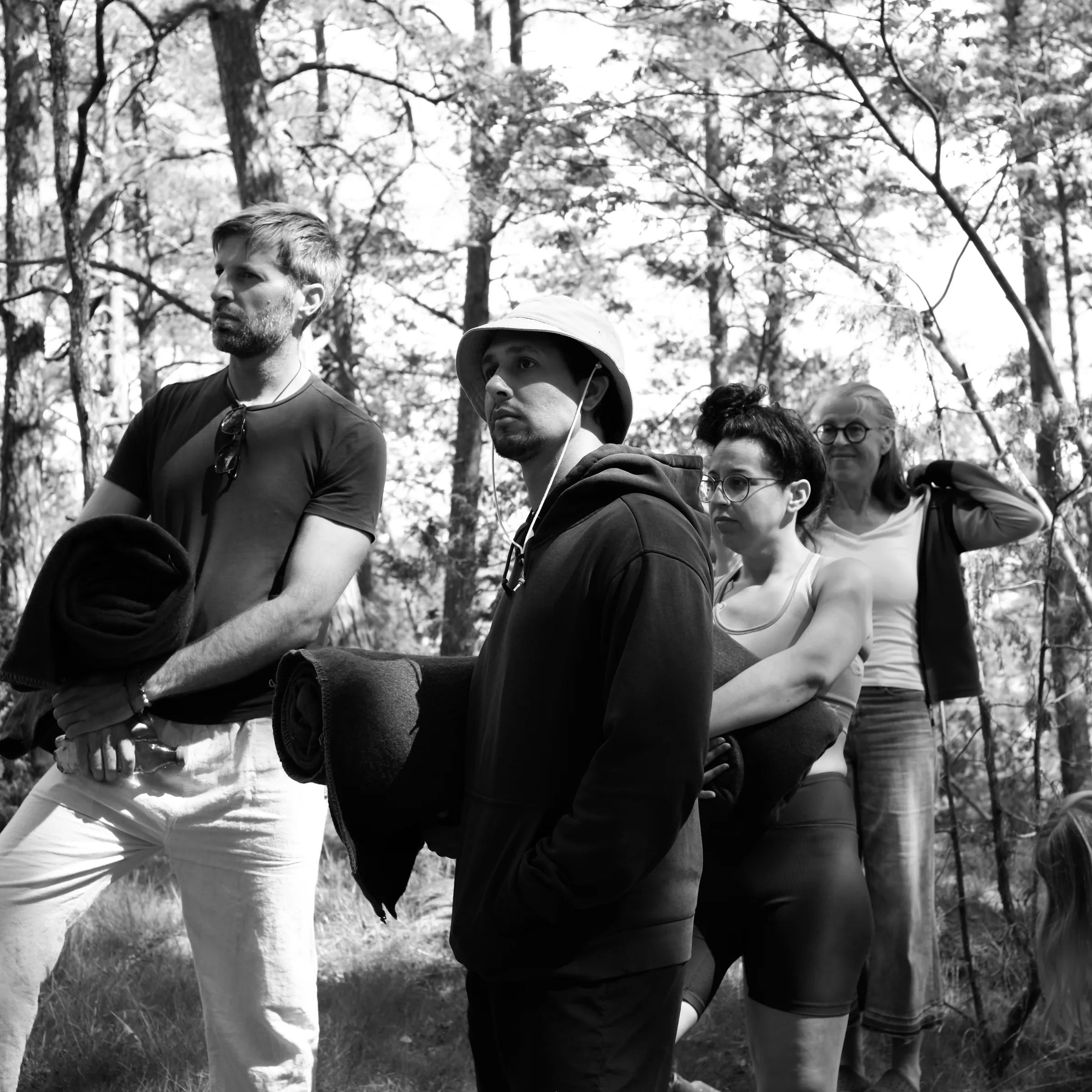 A group of participants gathered in the woodland at Lakefront.