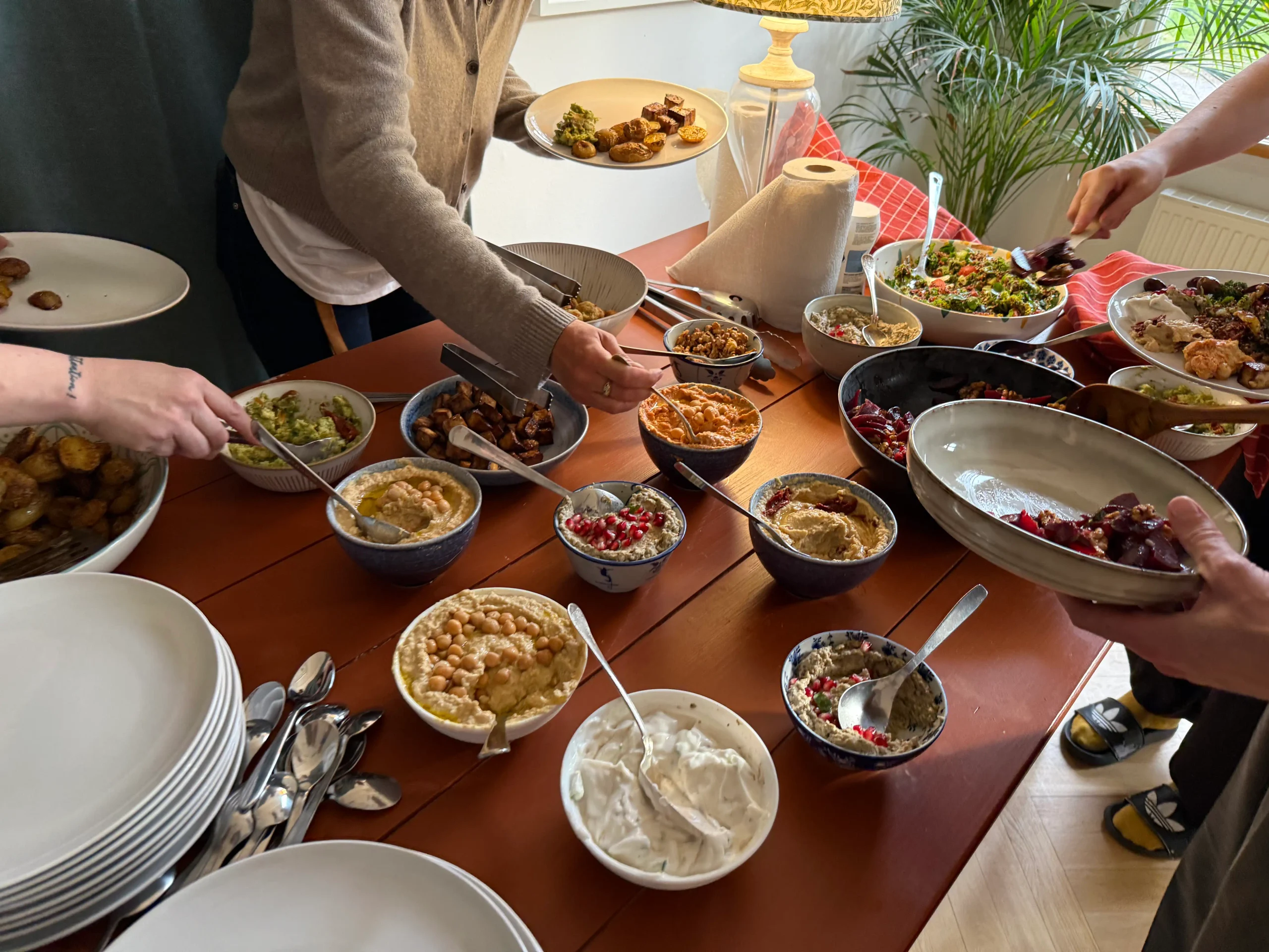 Residents serving themselves from a shared meal at Lakefront.