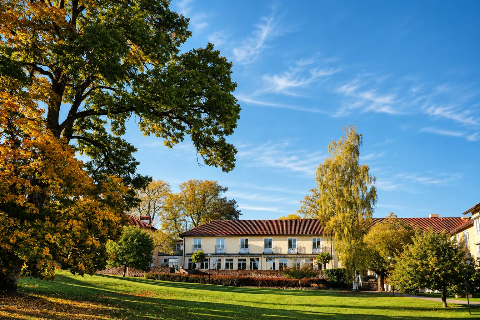 The main building and surrounding grounds at the Lakefront campus in autumn.